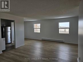 Aurora (Hills Of St Andrew) apartment for rent - A spacious room with wooden flooring and two windows.