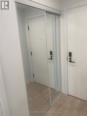 Milton (Cb Cobban) condo for rent - A white door with a glass panel and a handle.