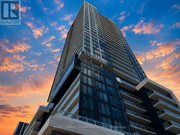 Toronto (Banbury-Don Mills) condo for rent - A tall building with the words "Royal LePage Signature Realty Brokerage" on it.