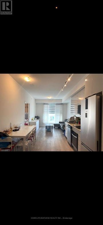 Vaughan (Concord) condo for rent - A well-lit kitchen with a dining table set for four.