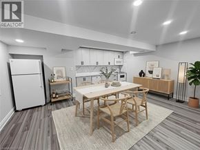Kitchener apartment for rent - A well-lit, spacious living room with a kitchen area in the background.