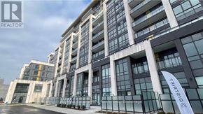 Oakville (Go Glenorchy) condo for rent - A modern building with glass windows and a sign that reads "TARIATIC".