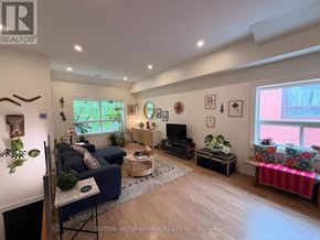 Toronto (Oakwood Village) apartment for rent - A living room with a blue couch and a wooden floor.