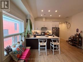 Toronto (Oakwood Village) apartment for rent - A kitchen with a dining table and chairs is shown.