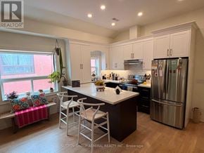 Toronto (Oakwood Village) apartment for rent - A kitchen with a white countertop and stainless steel appliances.