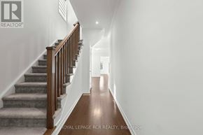 Southgate apartment for rent - A hallway with a staircase and a white wall.