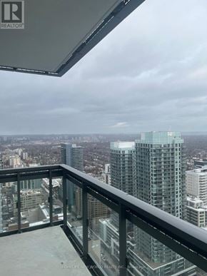 Toronto (Mount Pleasant West) condo for rent - A balcony with a view of a city skyline.