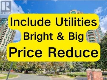 Toronto (Willowdale West) condo for rent - A sign with the text "Include Utilities Bright & Big Price Reduce" is displayed in front of a building.