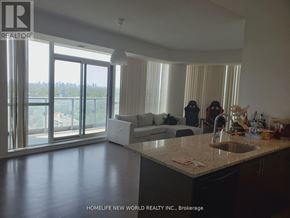 Toronto (Henry Farm) condo for rent - A realtor's photo of a modern kitchen and living room.