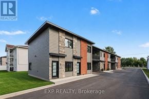 Russell apartment for rent - A row of houses with EXP REALTY, Brokerage written on the bottom.