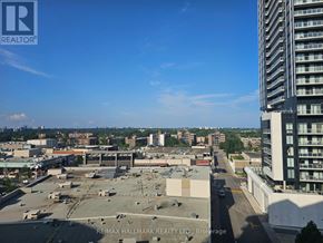 Toronto (Banbury-Don Mills) condo for rent - A view of a cityscape from a high vantage point, with a clear blue sky above.