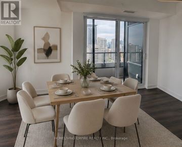 Toronto (North St. James Town) condo for rent - A dining room with a table set for two and a view of the city.