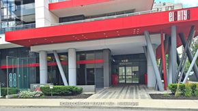 Toronto (Willowdale East) condo for rent - The front of a building with a red and white facade.
