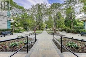 Vaughan (Crestwood-Springfarm-Yorkhill) condo for rent - A walkway in a park with trees on both sides.