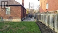 Toronto (Bedford Park-Nortown) apartment for rent - A small building with a sign that says "REALTOR" in front of it.