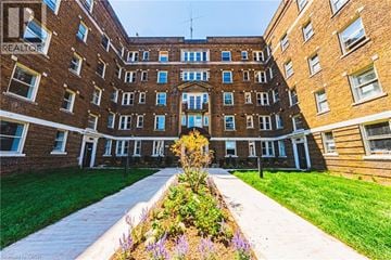 Hamilton apartment for rent - A building with a sign that says REALTOR.