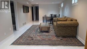 Mississauga (Erin Mills) apartment for rent - A living room with a rug and a couch.