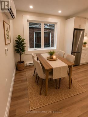 Toronto (Oakwood Village) duplex for rent - A dining room with a table set for four.