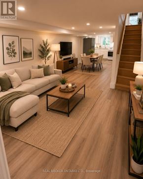 Toronto (Oakwood Village) duplex for rent - A well-lit living room with a staircase leading to the upper floor.