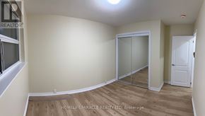 Brampton (Avondale) apartment for rent - A room with a glass door and a white door.