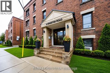 Toronto (Woodbine Corridor) condo for rent - A building with a sign that says Kingston Road in front of it.
