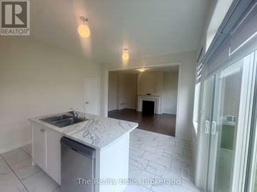 Melancthon apartment for rent - A kitchen with a marble countertop and a sink is shown in a real estate listing.