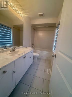 Melancthon apartment for rent - A white bathroom with a sink, toilet and shower.