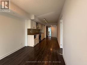 Toronto (Mount Pleasant West) condo for rent - A long hallway with a kitchen area at the end.