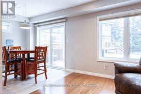 Stratford townhouse for rent - A dining room with a table and chairs.