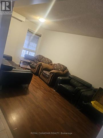 Brampton (Fletcher's Creek South) apartment for rent - A living room with a couch and a chair.