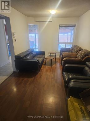 Brampton (Fletcher's Creek South) apartment for rent - A living room with a couch, chair, and coffee table.