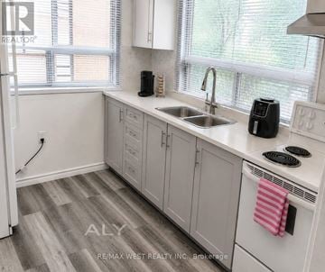 Toronto (Corso Italia-Davenport) apartment for rent - A kitchen with white cabinets and a sink.