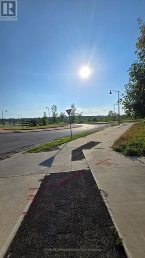 Pelham (Fonthill) house for rent - A sunny day at a street corner with a red stop sign.