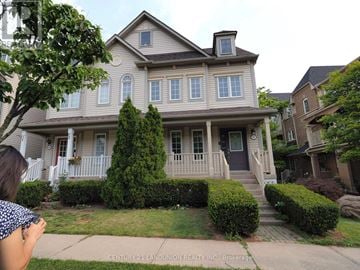 Oakville (Ro River Oaks) apartment for rent - A house with a brown roof and a white fence.