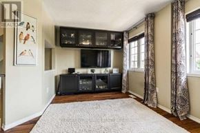 Oakville (Ro River Oaks) apartment for rent - A living room with a television and a rug.