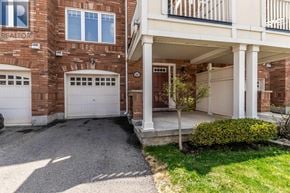 Milton (Ha Harrison) townhouse for rent - A house with a garage and a covered patio.
