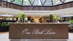 Toronto (Kensington-Chinatown) condo for rent - A reception desk with the words "One Park Lane" written on it.