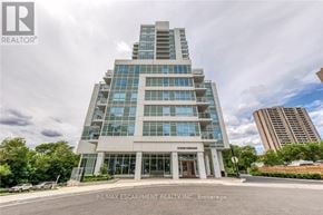 Toronto (Weston) condo for rent - A modern building with the sign "RE/MAX ESCARPMENT REALTY INC." in front of it.