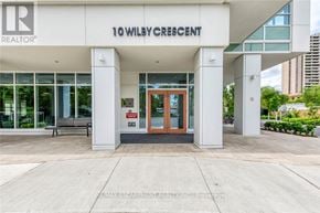 Toronto (Weston) condo for rent - The front of a realtor office with the name 10 Wilby Crescent on the top.