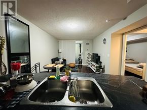 Toronto (Bendale) condo for rent - A kitchen with a sink and a mirror.