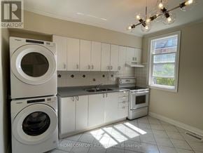 Toronto (Weston-Pellam Park) apartment for rent - A white washer and dryer are stacked on top of each other in a laundry room.