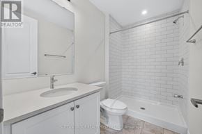 Oakville (Jm Joshua Meadows) townhouse for rent - A white bathroom with a toilet, sink, and bathtub.
