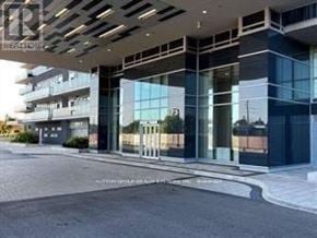 Burlington (Freeman) condo for rent - A modern building with a glass facade and a white roof.