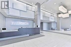 Burlington (Freeman) condo for rent - A real estate office with a reception desk and a sign that says "PARADIGM".