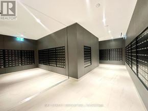 Toronto (Mount Pleasant West) condo for rent - A brokerage office with a white floor and black walls.