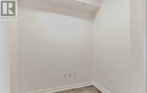 Toronto (Waterfront Communities) condo for rent - A white room with a Realtor logo on the top left corner.