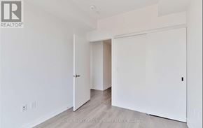 Toronto (Waterfront Communities) condo for rent - A white room with a door and a window.
