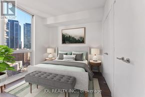 Toronto (Church-Yonge Corridor) condo for rent - A bedroom with a large bed and a city view through the window.