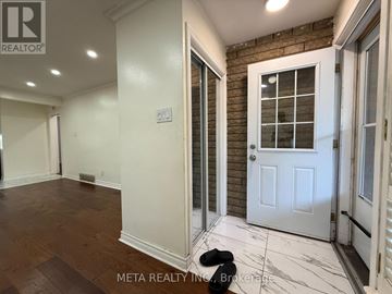 Toronto (Bendale) apartment for rent - A room with a white door and a brick wall.