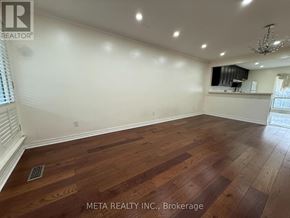 Toronto (Bendale) apartment for rent - A room with wooden flooring and a chandelier.